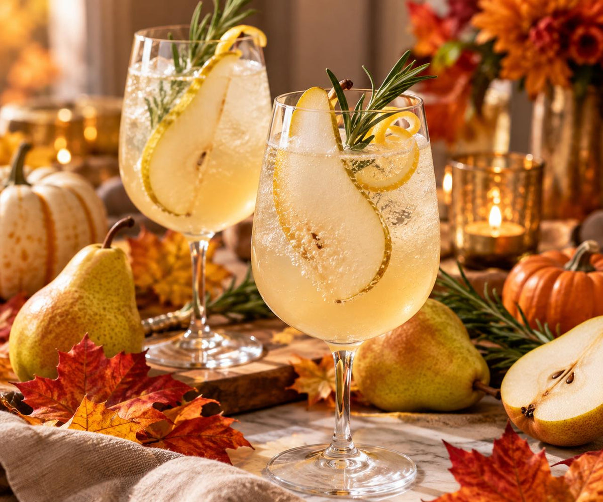 Hero shot of the finished drink with fresh pears and subtle fall décor.